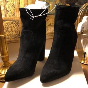 Black boots with tags